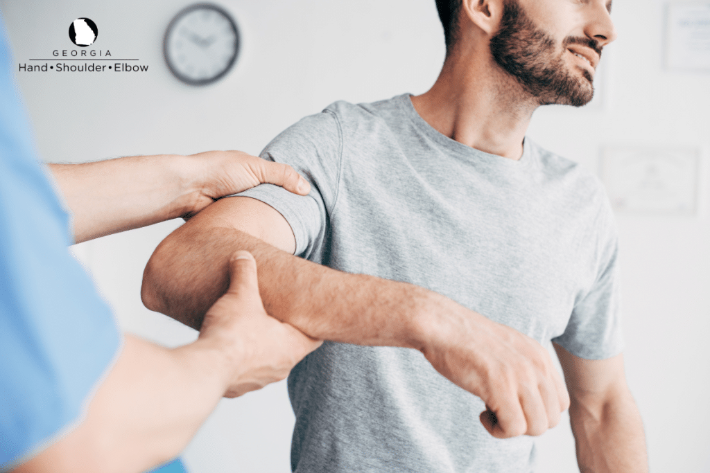 A man doing physical therapy exercises to aid in recovery from rotator cuff surgery in Georgia.