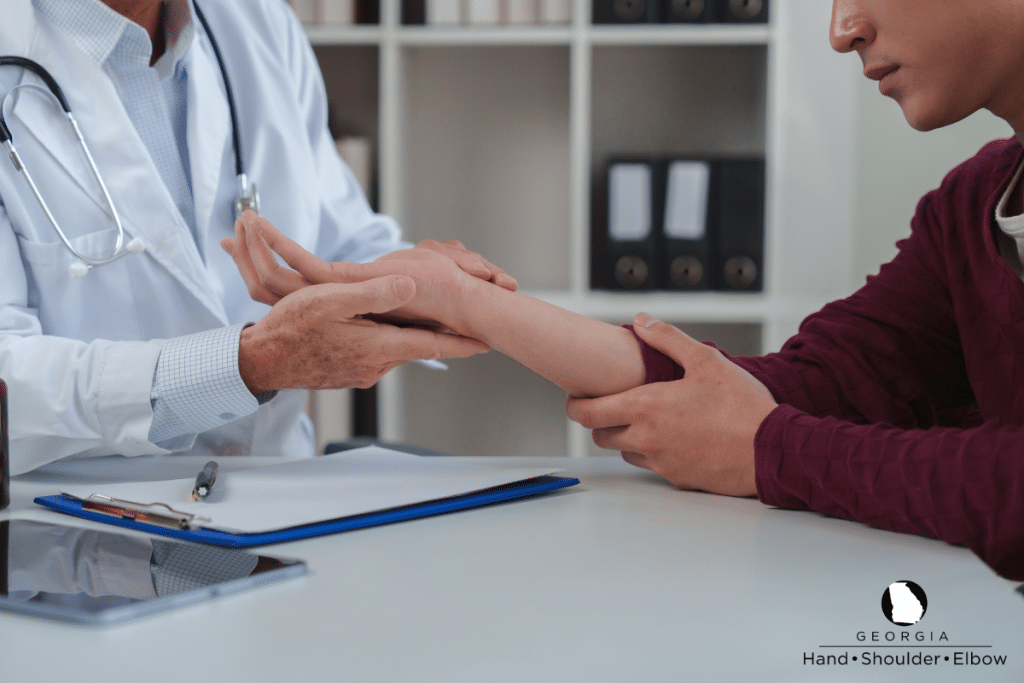 A doctor examining a patient’s arm before they undergo surgery in Georgia.